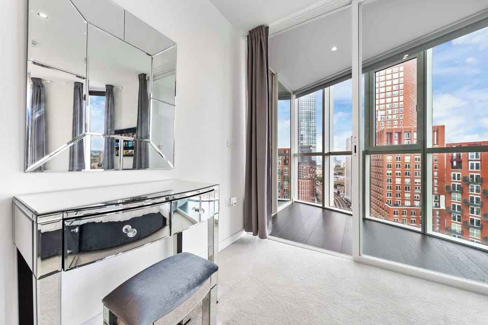 Take your time getting ready at the elegant vanity before heading out.