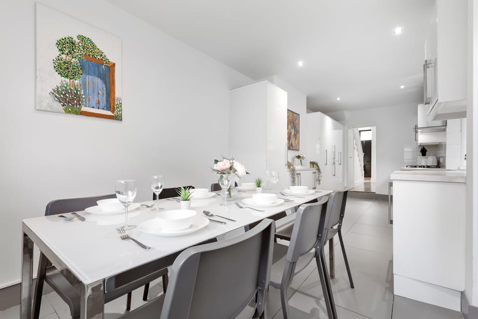 Dine in style in the elegant dining area with contemporary table settings.