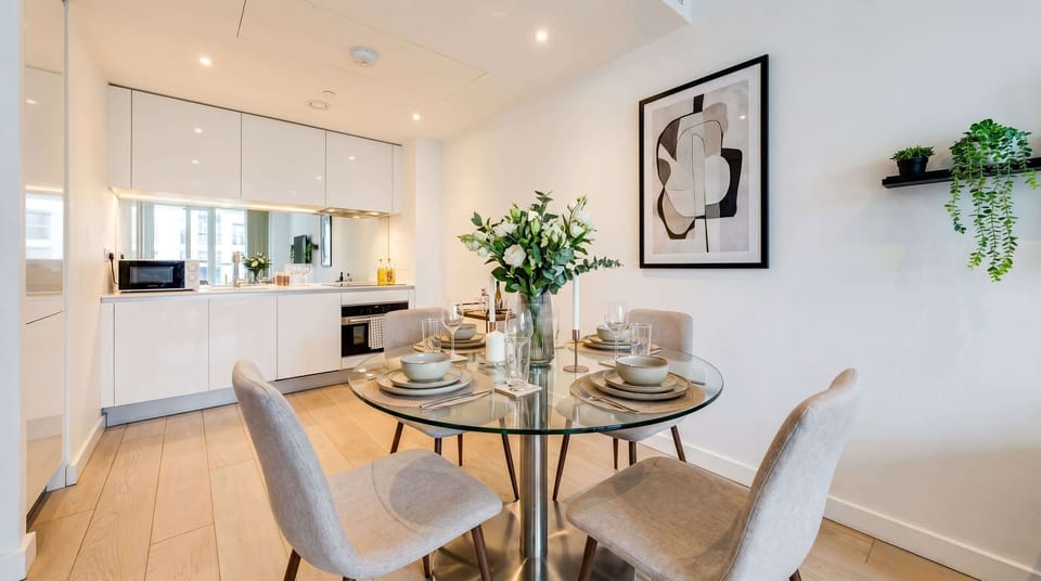Dine elegantly at the glass table set for intimate gatherings.