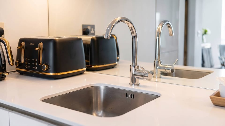 Clean and functional kitchen sink area designed for your everyday convenience.
