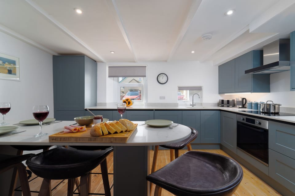 Open-plan living— The modern breakfast bar links the kitchen and lounge