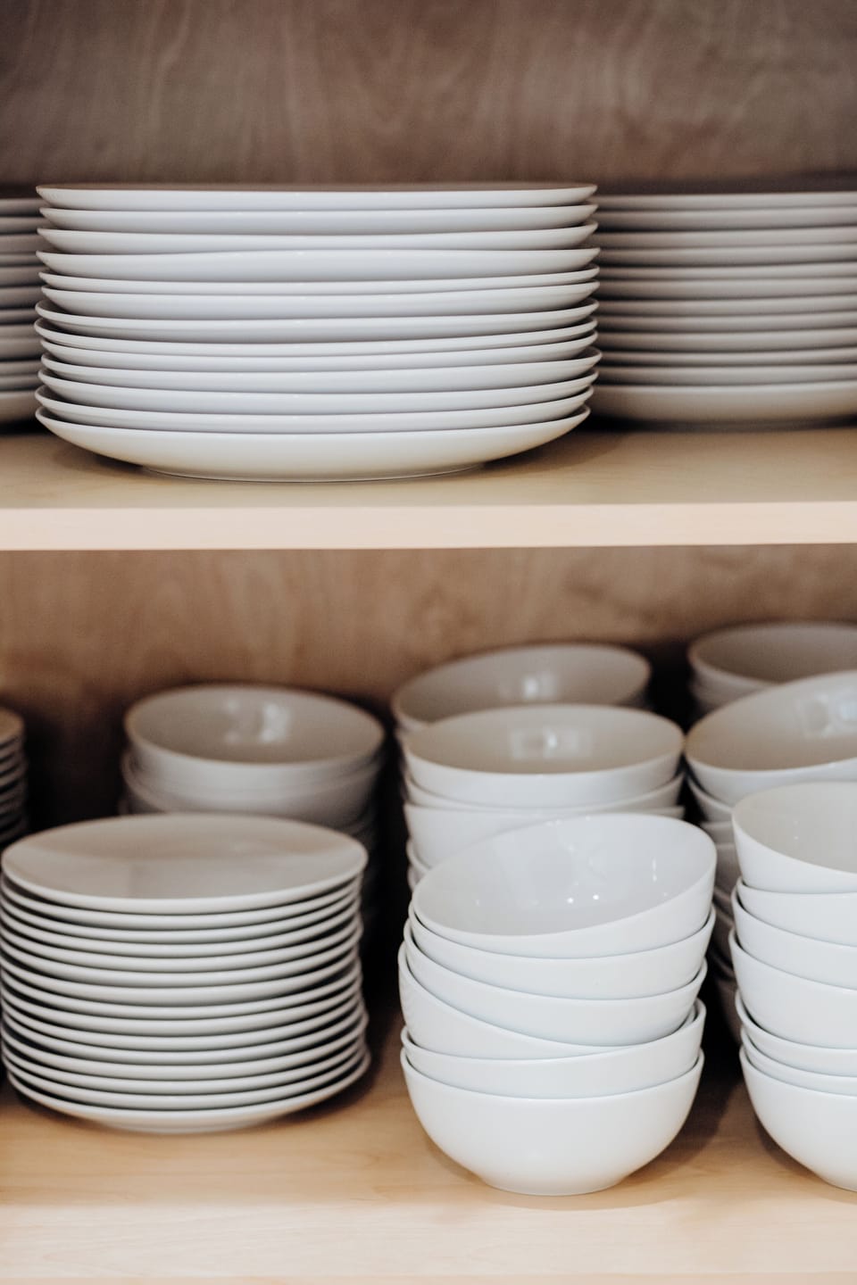 Find a pantry already stocked with plates and bowls for everyone, so a dinner for eighteen never means a paper-plate scramble.