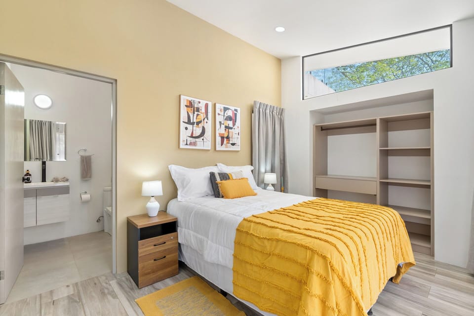 Bedroom with ensuite bathroom and closet 