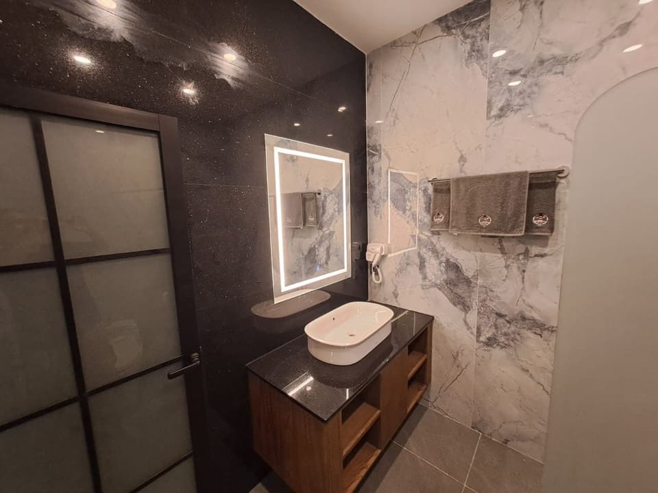 Triple Room Pool View | Bathroom | Shower, hair dryer, towels, soap