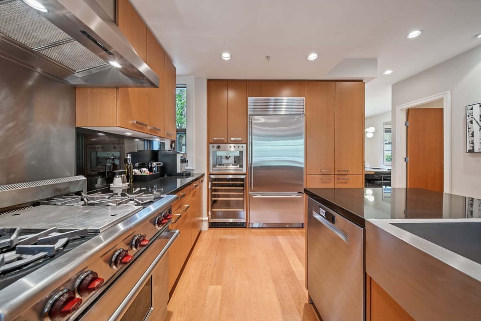 Kitchen - Wolf range, Sub-Zero fridge, and wine fridge — everything you need for a great family dinner
