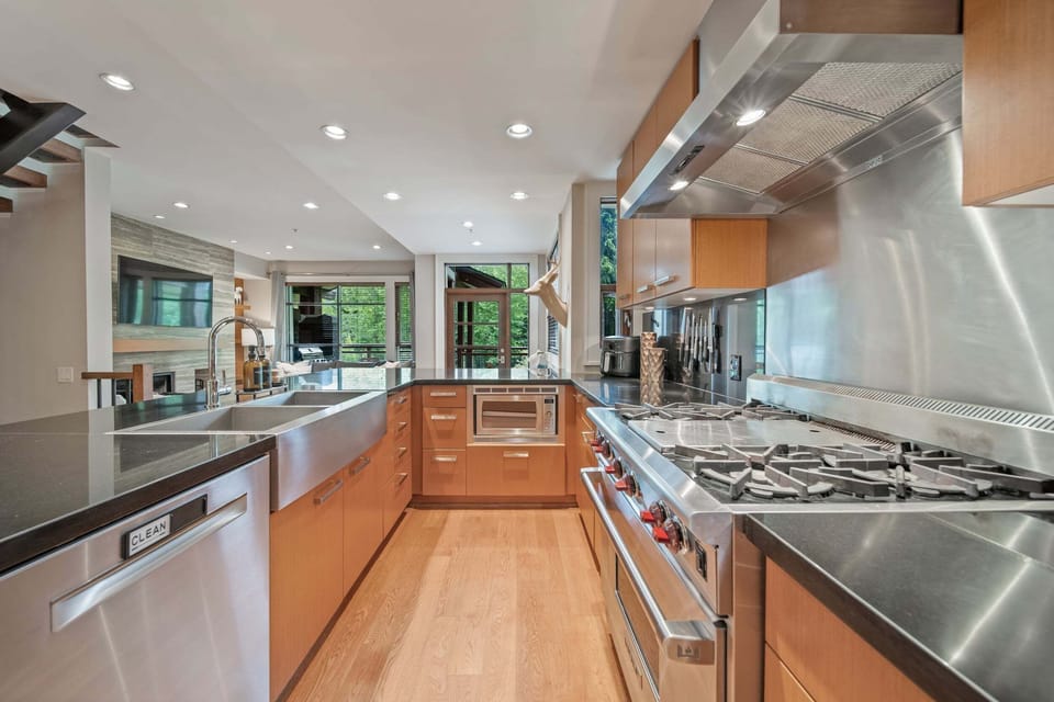 Kitchen - Professional Wolf range and hood — serious cooking capability for the whole group