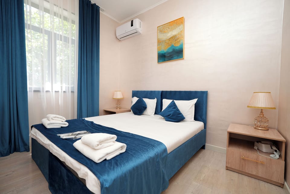 Double or Twin Room, City View | Pillowtop beds, WiFi (free), bed sheets