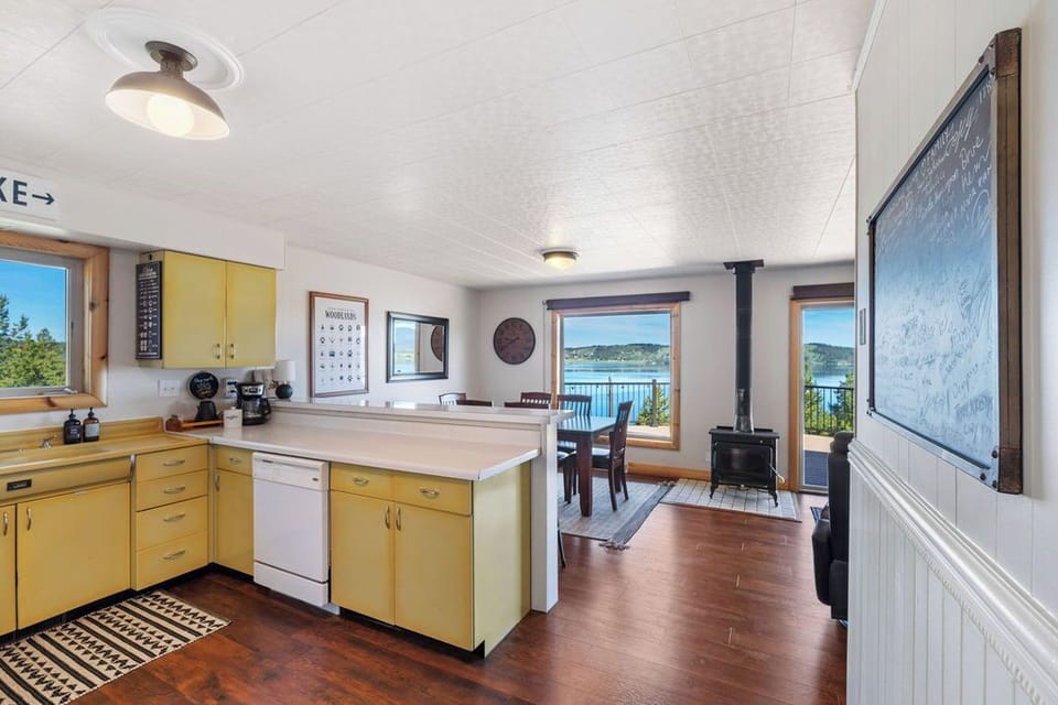 Beautiful views from the kitchen and dining area.  Please note the wood burning stove is not available for guest use.