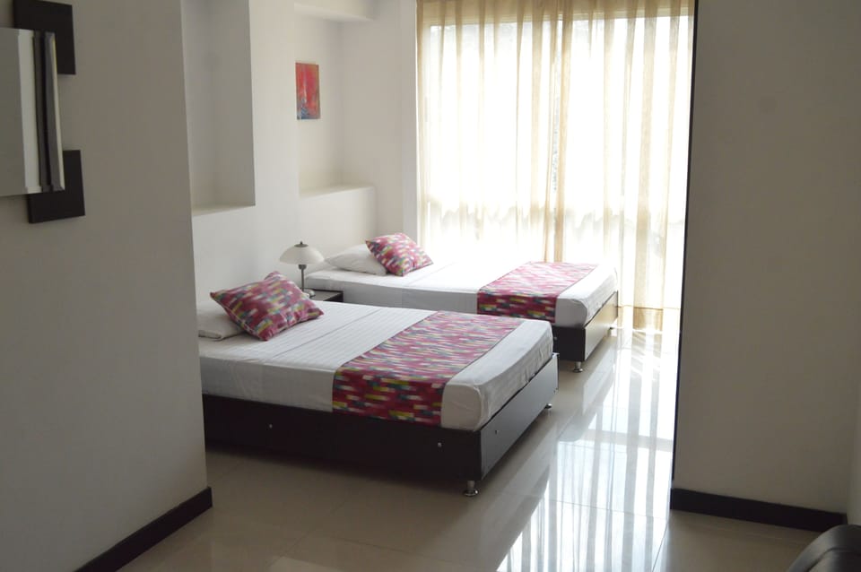 Standard Twin Room | Pillowtop beds, blackout drapes, WiFi (free), bed sheets