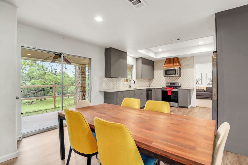 The kitchen is behind the dining room