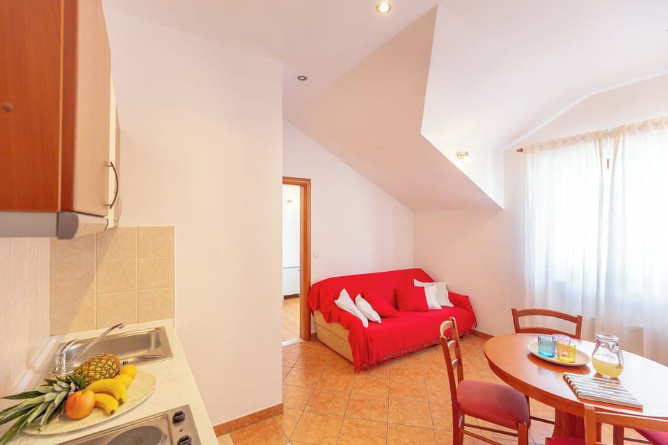 Apartment (1 Bedroom) | Living area | 80-cm flat-screen TV with digital channels