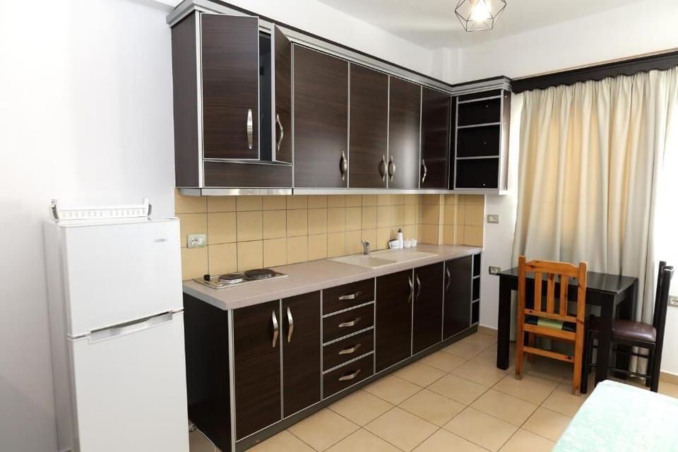 Apartment, Balcony, Sea View | Private kitchen | Fridge, electric kettle, dining tables