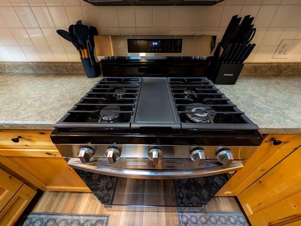 Modern gas range with griddle for easy, guest-friendly cooking