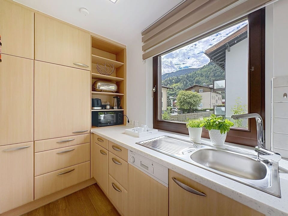 Kitchen, Countertop, Wood, Interior Design, Cabinetry, Kitchen Appliance, Home, Flooring, Plumbing Fixture, Tap