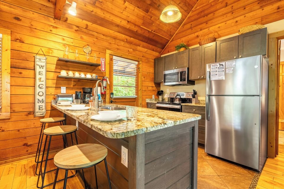 Your fully equipped kitchen invites you to gather, cook, and create memories with granite counters, stainless appliances, and warm cabin charm throughout.