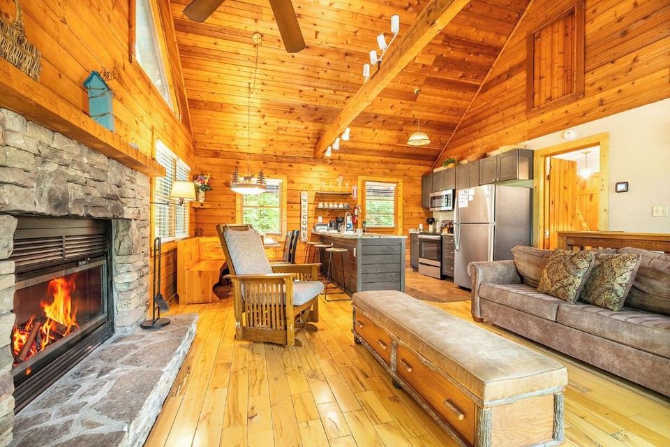 Wrap yourself in the warmth of soaring wood ceilings, a crackling stone fireplace, and an open living space that invites you to unwind, cook, and gather.