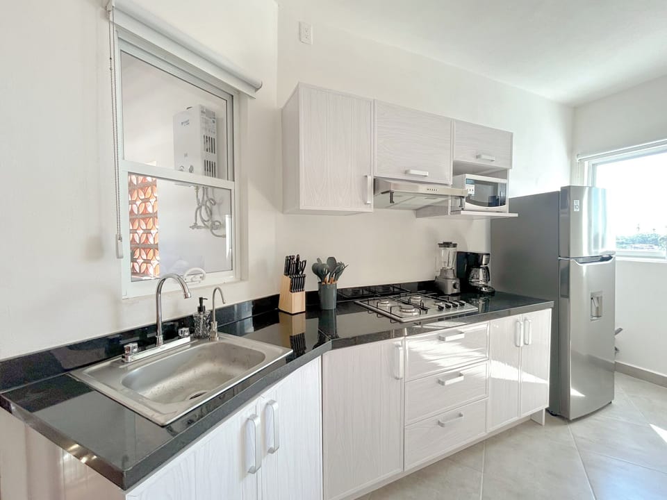 Comfort Apartment | Private kitchen | Full-size fridge, microwave, oven, stovetop