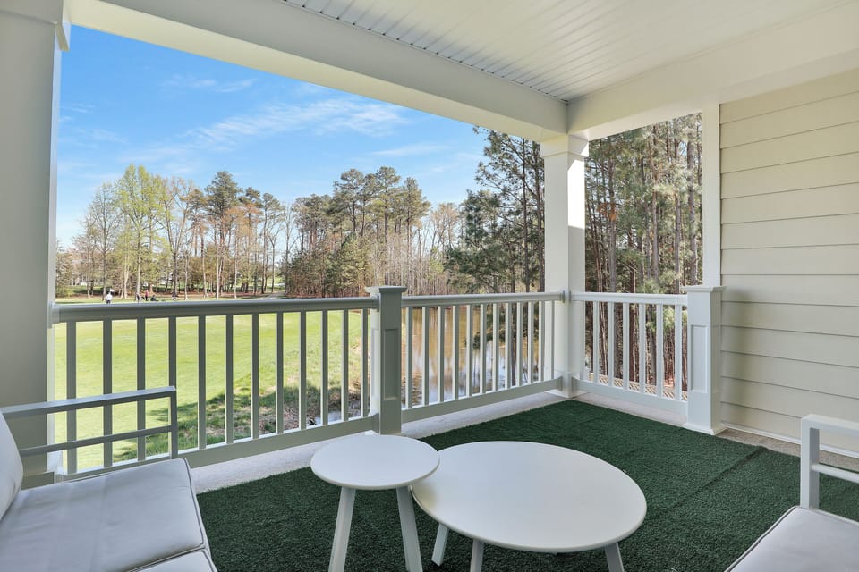 Rear 2nd-floor balcony — 4 seats above pond and 3rd green, southeast-facing