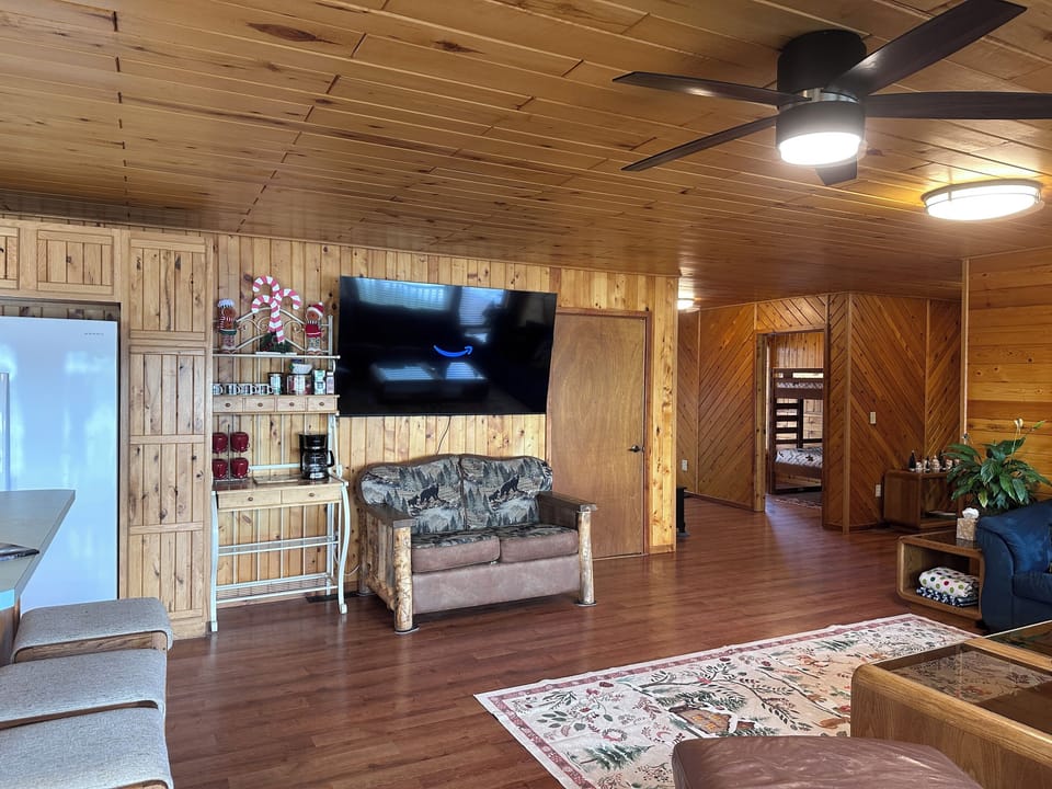 Living room with new 75" Roku Smart TV including an Amazon Prime subscription