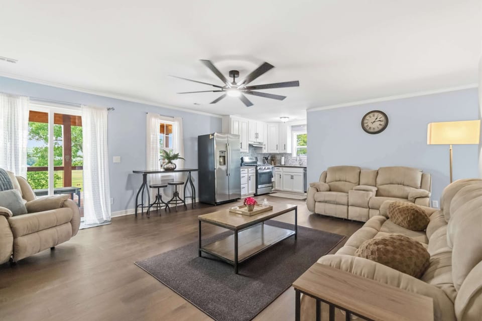 Gather and converse in the spacious open plan living room.