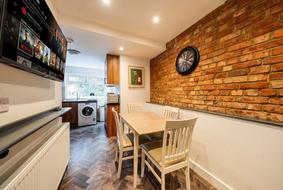 Dine beneath the exposed brick feature wall with a touch of urban character
