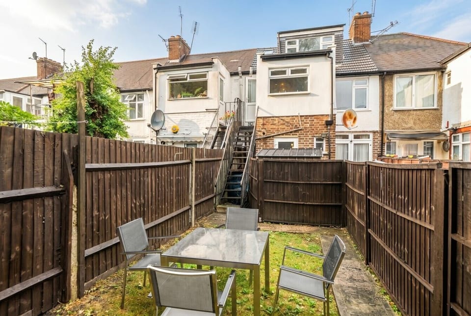 Enclosed rear garden with outdoor table for easy al fresco moments