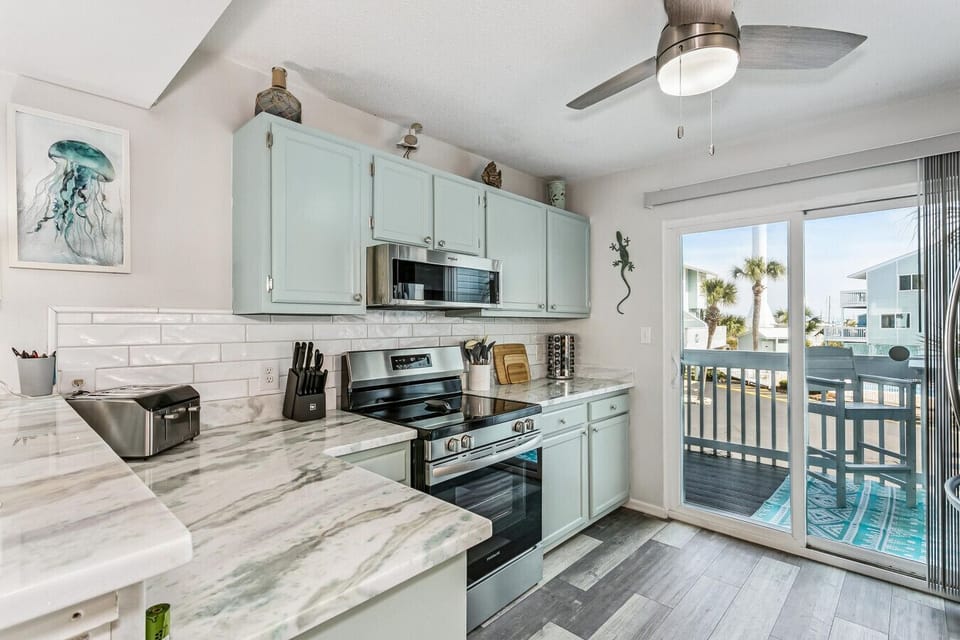 Fully-Equipped Kitchen with Pool Views