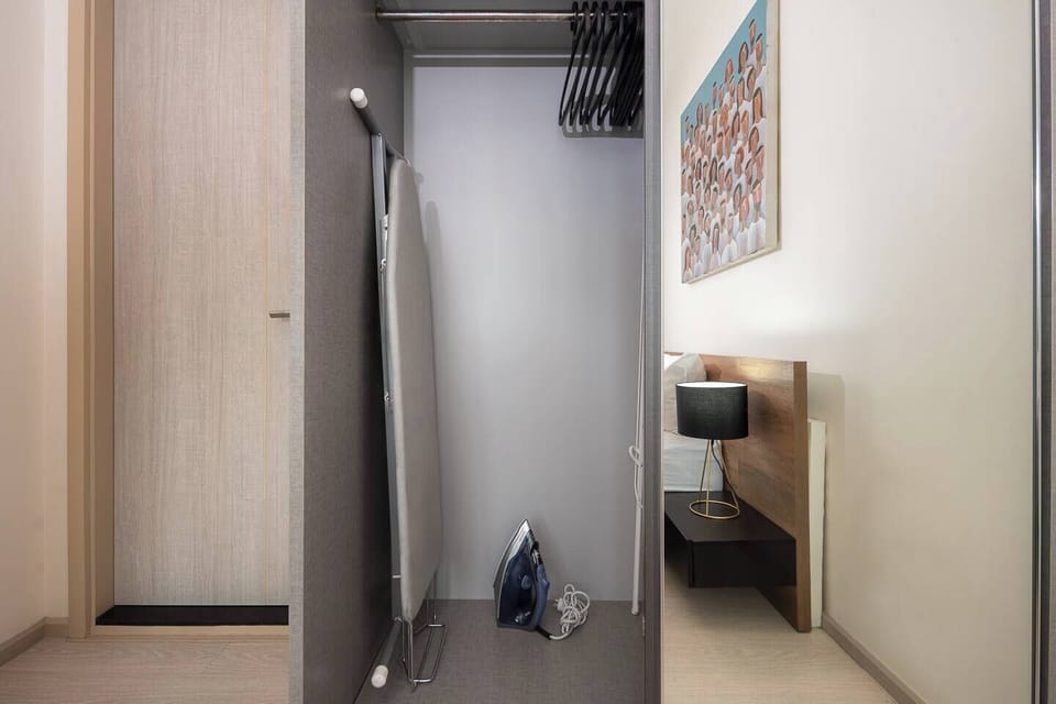 Inside the wardrobe, you’ll have access to an iron, ironing board, and hangers, all ready for you to use. Open the other side, there’s additional empty space available for you to store your things comfortably.