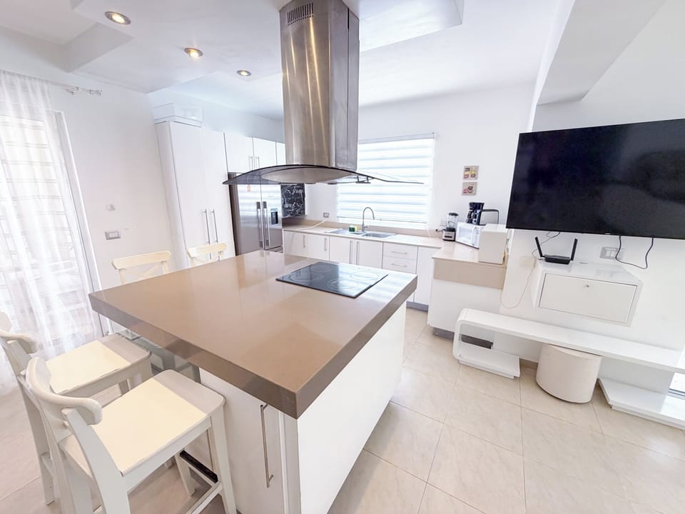 Superior Apartment, Pool View | Private kitchen | Coffee/tea maker, fridge, stovetop, cookware/dishes/utensils