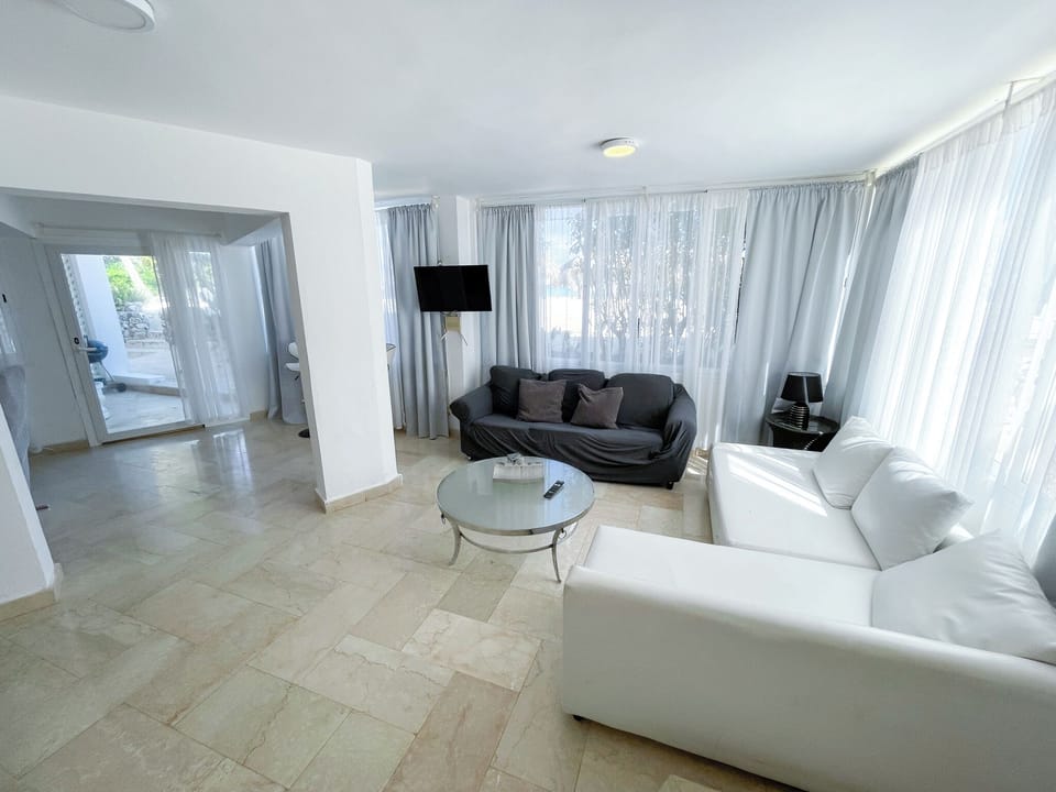 Deluxe Apartment, Beach View | Living area | LCD TV