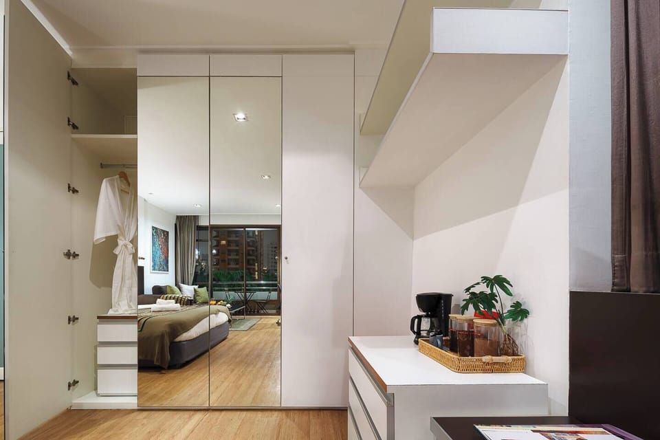 Spacious Wardrobe for Two: Plenty of space and hangers to keep your clothes neat. Plus, a full-length mirror for easy dressing and getting ready.