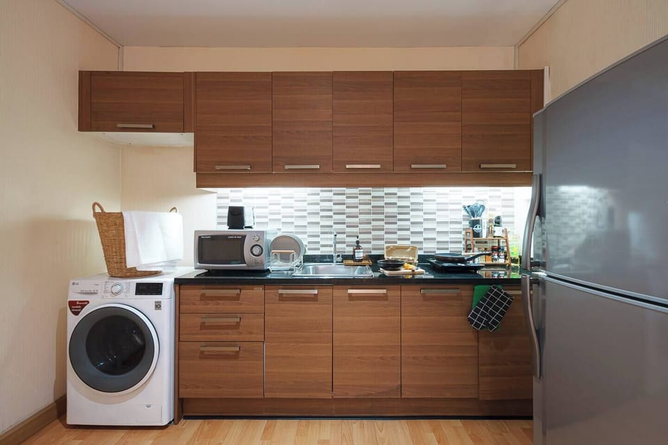 Kitchen area: In-unit washing machine with English instructions use it as much as you like, feel like home with fresh clothes also equipped kitchen for cook your favorite meals.