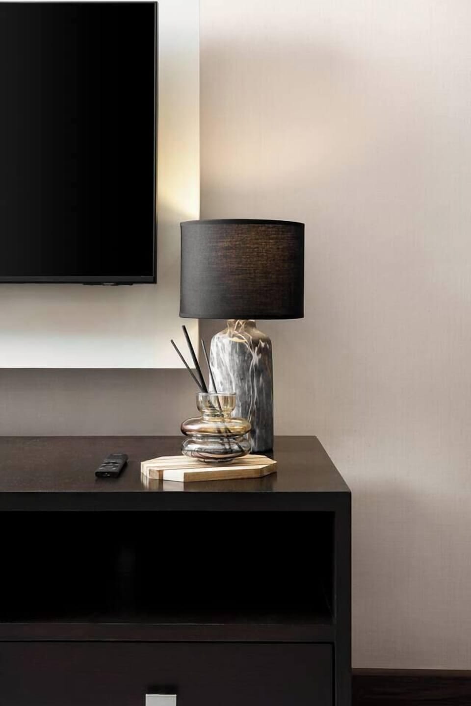 In the living room, there’s a lamp next to the TV and a standing floor lamp you can use to warm up the space.