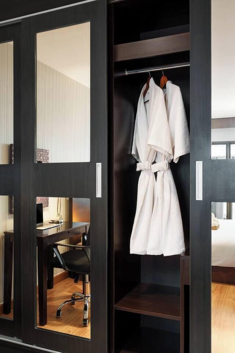 Spacious wardrobe with plenty of room for both his and her clothes, plus large mirrors that make getting ready a breeze.
