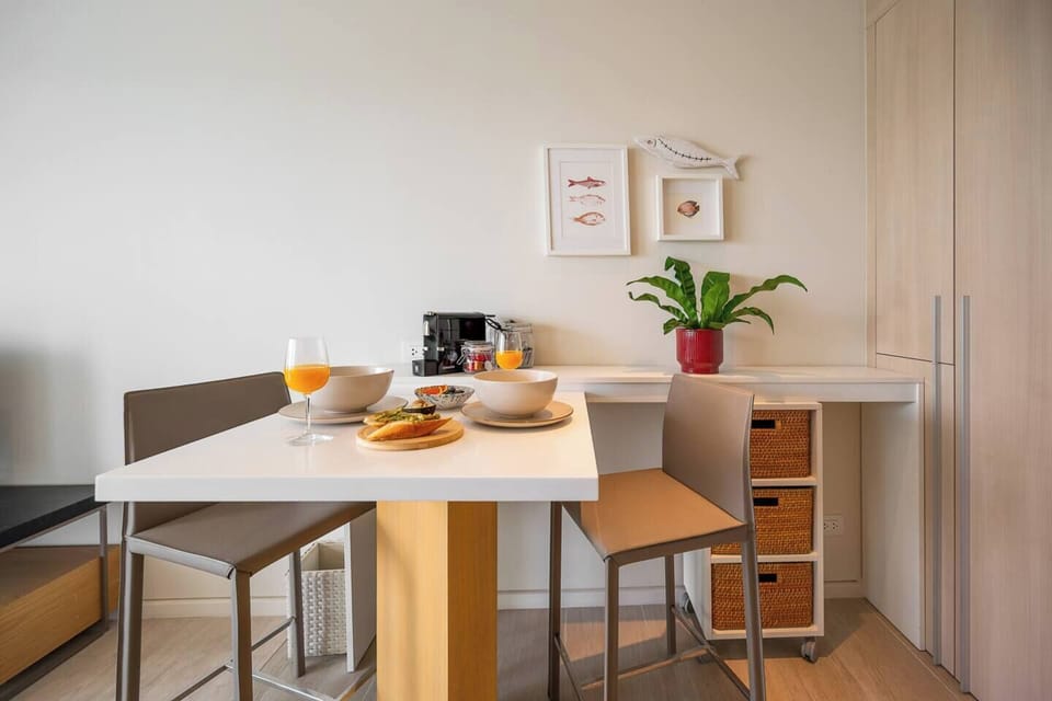 dining area with higher chairs where it connected with kitchen.