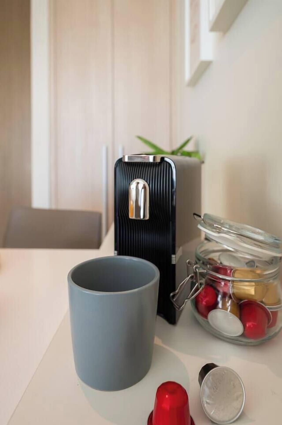 Coffee machine with capsule and teabag are placed at the dining area.