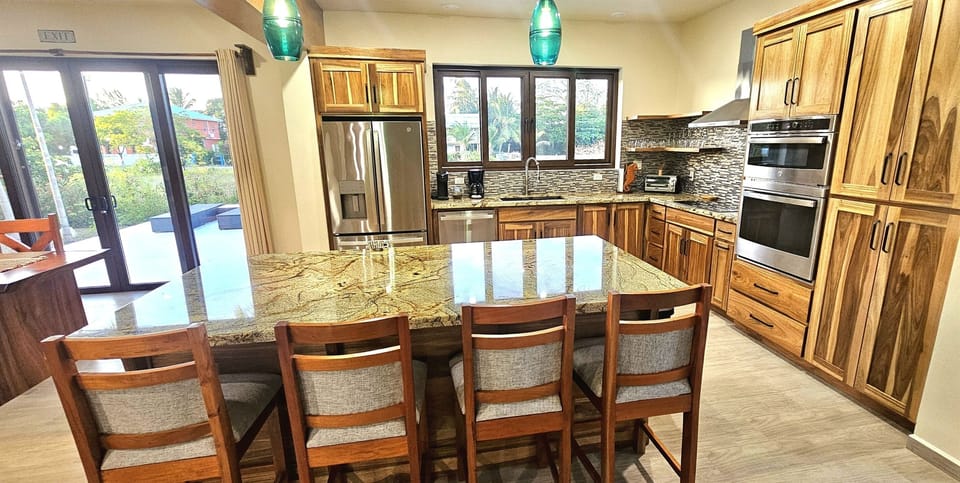 Modern and open concept Kitchen,  with all the essentials that you need to cook.