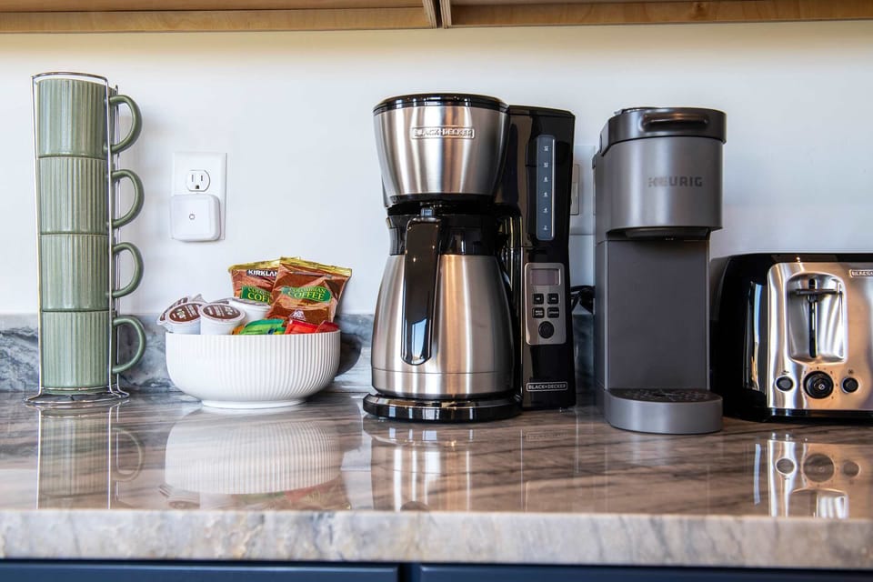 Everything for coffee and espresso sits ready on the counter each morning.