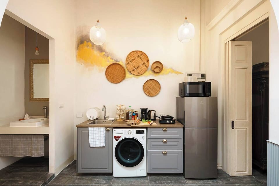 【 Kitchen area , Ground Floor 】cook like a local, with all the basics provided from pots and pans to utensils. A fridge to store and a microwave for quick meals , an in-unit washing machine for your convenience.