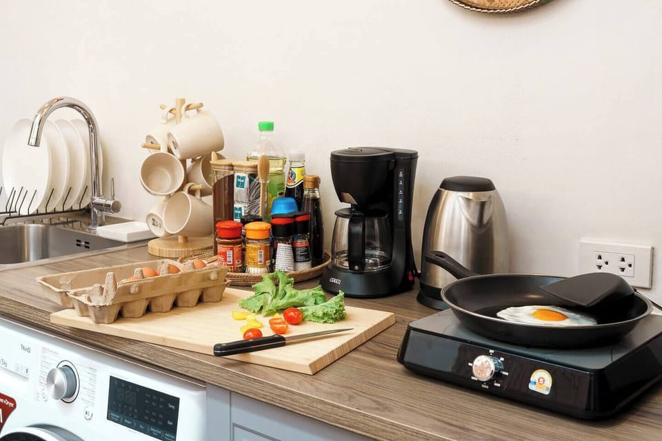 【 Kitchen area , Ground Floor 】 Stocked with all the essentials also includes a stove and coffee maker that are easy to use, so you can quickly prepare your meals or enjoy a fresh cup of coffee anytime.