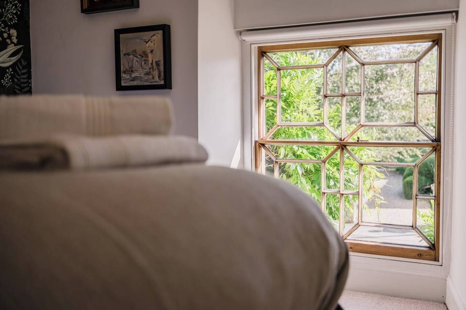 Sun filled light bedroom with views