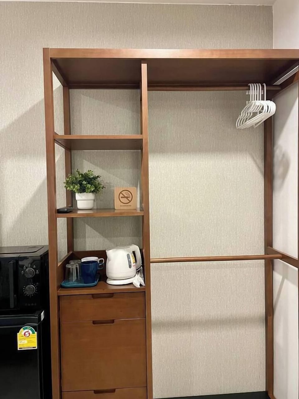 【Bedroom Closet】Spacious storage with racks and hangers provided. Hair dryer ready for your night out prep. "Love the thoughtful amenities!" Streamline your stay with organized spaces and convenient touches for effortless styling.