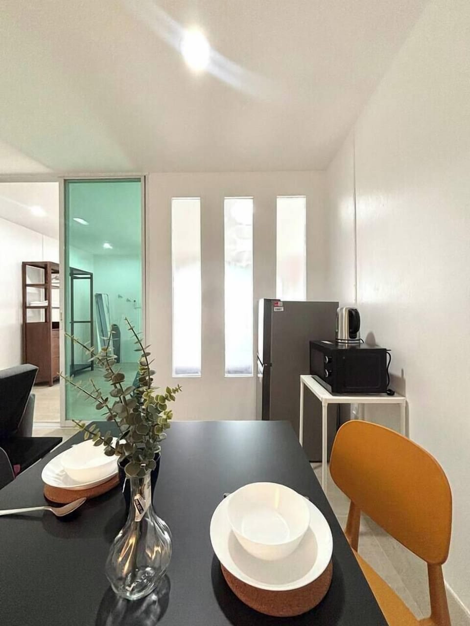 The dining and living areas are set apart from the bedroom, allowing you to enjoy your own private space.