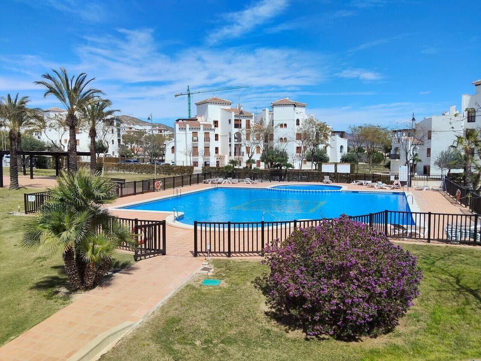Largest pool in famous El Valle Golf Resort, sun loungers, outdoor showers.