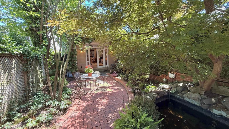 Enjoy morning coffee or evening conversation in this secluded courtyard surrounded by mature trees and greenery.