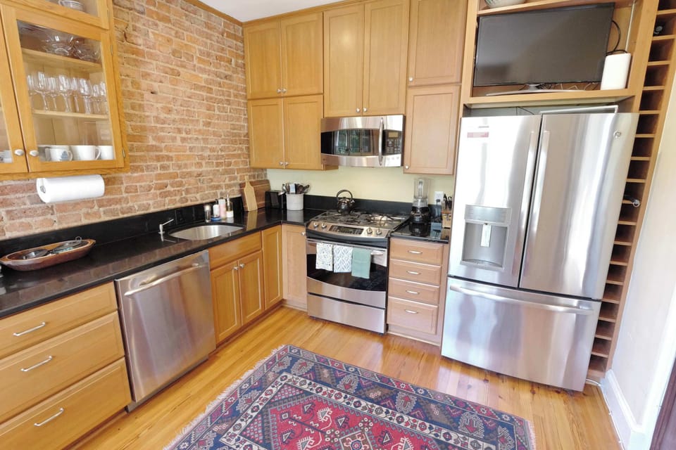 A full suite of appliances provides convenience and flexibility for everything from quick breakfasts to family dinners.