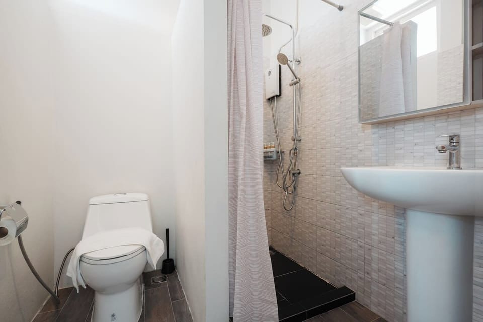 Bright, compact bath with walk-in shower and modern fixtures
