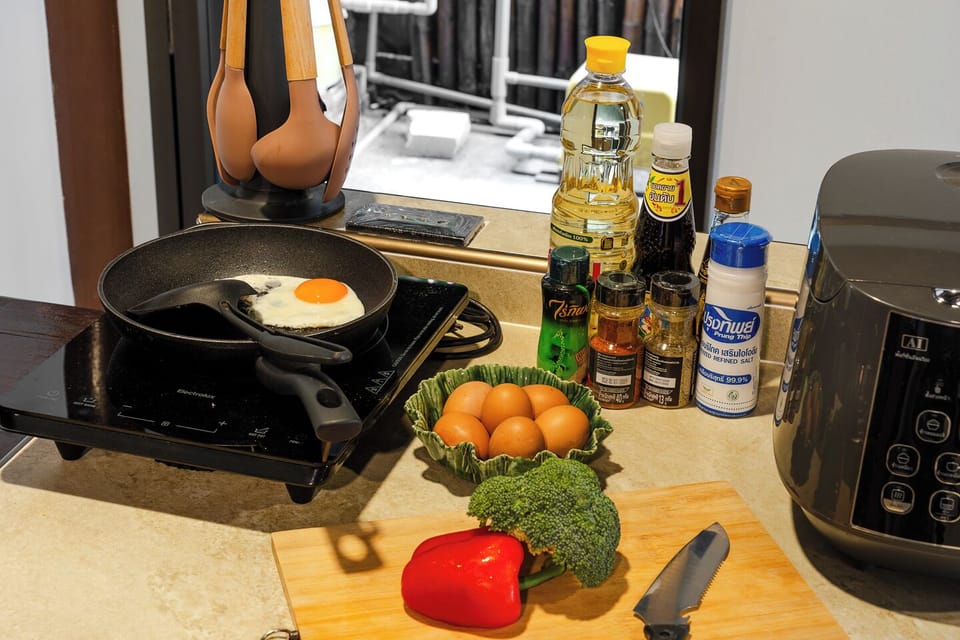 Cook with ease using the induction hob, air fryer, and stocked kitchen essentials