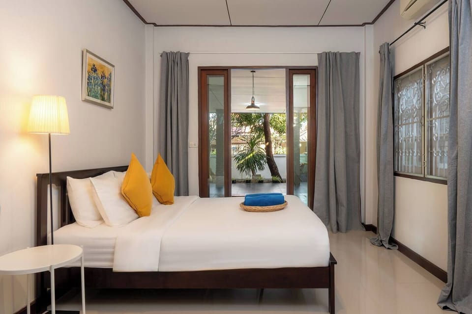 【Master Bedroom】Sleep soundly with blackout curtains, charge devices bedside, and enjoy direct pool access. Each bedroom includes a private en-suite bathroom for maximum comfort and convenience throughout your stay.