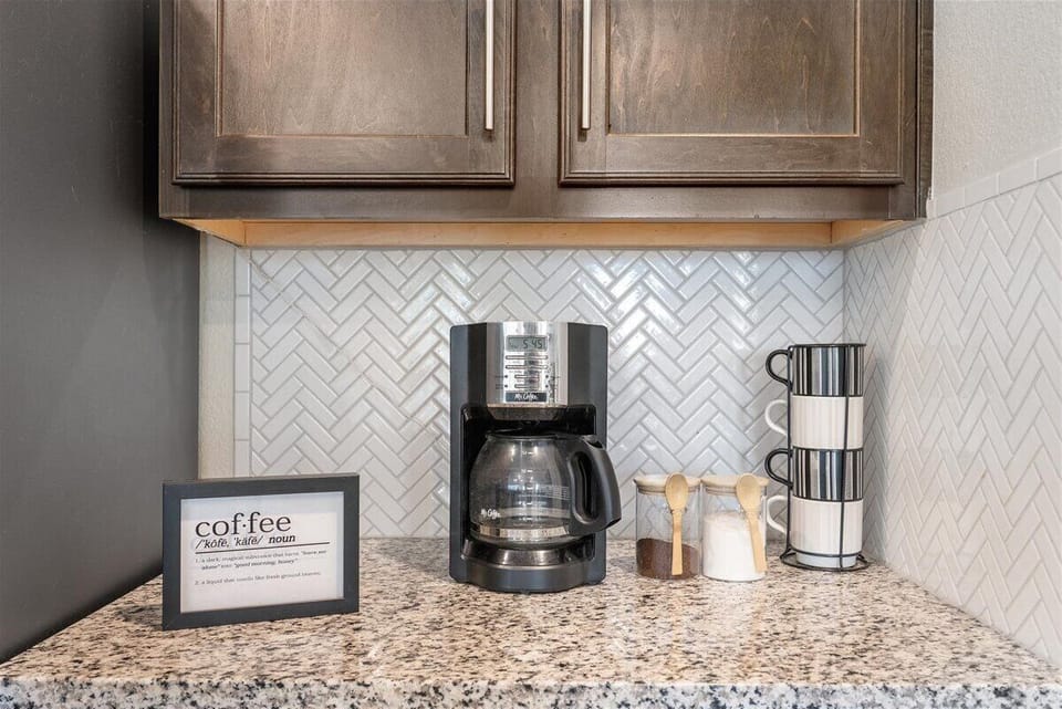 Kitchen: The kitchen is equipped with a regular drip coffee maker. 